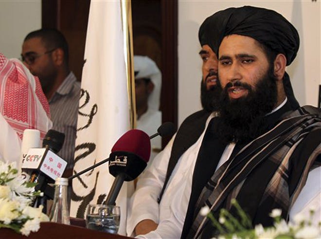 Muhammad Naeem a representative of the Taliban speaks during a press conference at the official opening of their office in Doha, Qatar, Tuesday, June 18, 2013. In a major breakthrough, the Taliban and the U.S. announced Tuesday that they will hold talks on finding a political solution to ending nearly 12 years of war in Afghanistan as the Islamic militant movement opened an office in Qatar. American officials with the Obama administration said the office in the Qatari capital of Doha was the first step toward the ultimate U.S.-Afghan goal of a full Taliban renouncement of links with al-Qaida.
