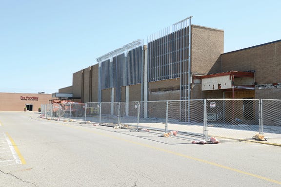 Work continues Tuesday at the Adrian Mall. Hobby Lobby Creative Center is scheduled to move into the former Sears store at the mall and open Aug. 1.