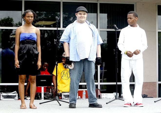 From left, Ariel Watson, Alfred Argenio and James Boykin, contestants in the Partnership Got Talent Idol contest, are introduced to the crowd. Singers were judged and awarded prizes during the competition.