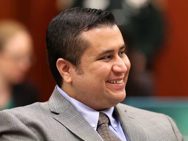 George Zimmerman smiles in response to a juror's answer during questioning in Seminole circuit court on the eighth day of his trial in Sanford on Wednesday.