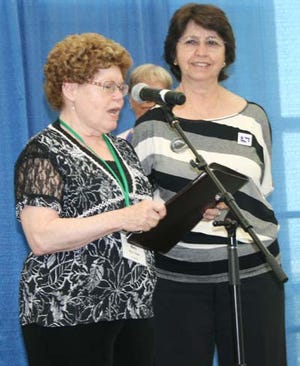 Submitted photo - Mary Bode, United Methodist Church Greater New Jersey Conference representative, hands Sparta UMC member Litsa Binder the Bishop’s Award.