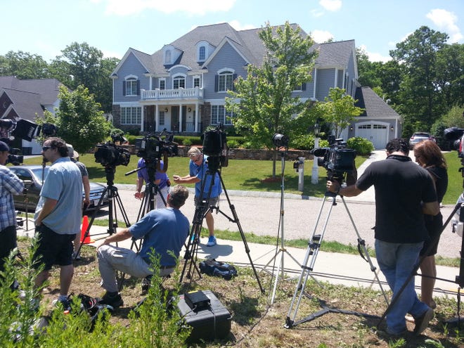 New mdia cameras are aimed toward the Aaron Hernandez's house in North Attleboro, Mass., on Wednesday.