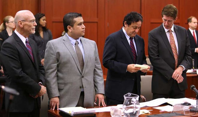 George Zimmerman, second from left, stands during the arrival of the jury pool, with his defense team, co-counsel Don West, left, jury consultant Robert Hirschhorn, second from right, and lead defense attorney Mark O'Mara in Seminole circuit court on the eighth day of his trial, in Sanford, Fla., Wednesday, June 19, 2013. Zimmerman has been charged with second-degree murder for the 2012 shooting death of Trayvon Martin.(AP Photo/Orlando Sentinel, Joe Burbank/Pool)