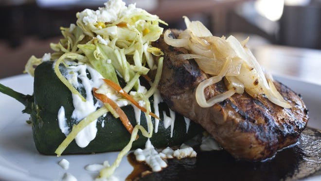 Mexican Coke marinates, tenderizes and glazes a lightly shimmering chuleta de puerco at El Alma.