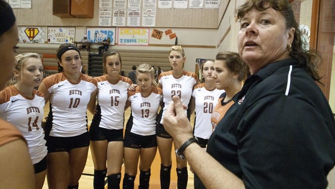 Former Hutto volleyball coach Janiece Nelson (right), who recently was reassigned to a non-coaching middle school athletic coordinator’s position, is fighting to get her old job back. She’ll have a grievance hearing on Friday.
