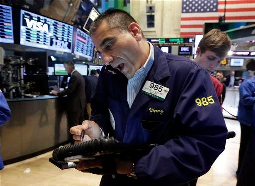 Trader Vincent Quinones, left, works on the floor of the New York Stock Exchange, Friday, June 21, 2013. U.S. stocks rose in morning trading on Friday as traders regrouped following the biggest drop of the year.