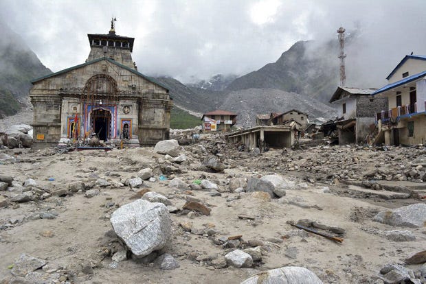 The Kedarnath shrine, one of the holiest of Hindu temples dedicated to Lord Shiva, and other buildings around it are seen damaged following monsoon rains in the northern Indian state of Uttrakhand.