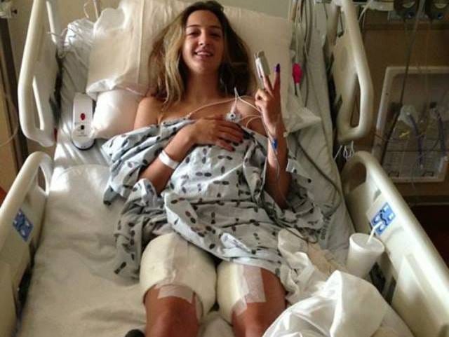 Rebecca Matous gives the peace sign while recovering at Halifax Health Medical Center after she was shot June 10.