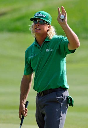 Charley Hoffman waves to the crowd after a birdie on the 18th hole during the first round of the Travelers Championship golf tournament in Cromwell, Conn., on Thursday.