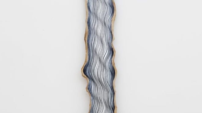 The “Jason Middlebrook: The Line That Divides Us” show at Lora Reynolds Gallery features painted hardwood slabs.