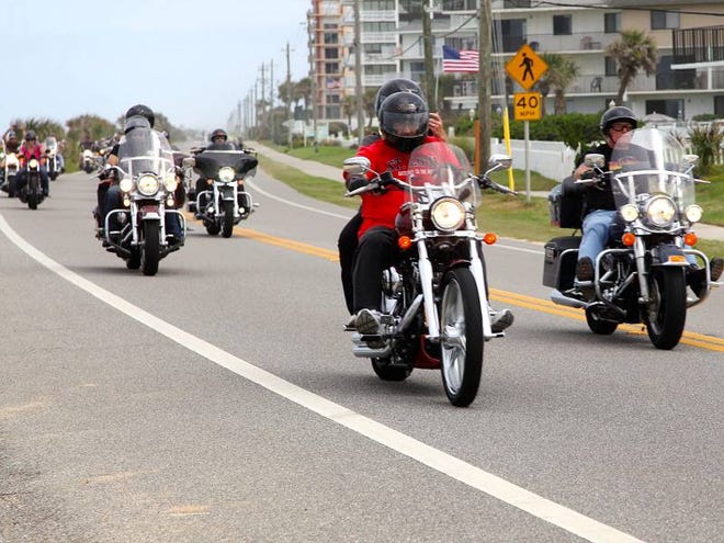 Iron Order Motorcycle Club members and friends cruise up State Road A1A on the south end of Flagler Beach during the club’s fourth annual Boys and Girls Club charity ride.