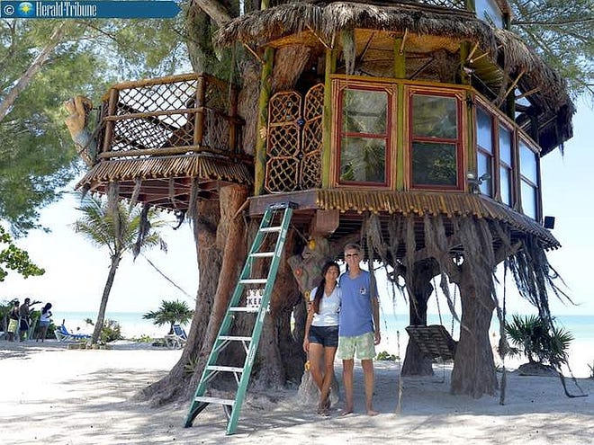 Richard Hazen and Lynn Tran, pictured June 10, built this two-story tree house on the beach of the Holmes Beach resort they own. The tree house cost $20,000 to construct and has stunning views of the Gulf. The city, however, wants it torn down. The treehouse is located at Angelino's Sea Lodge, 103 29th St. in Holmes Beach.