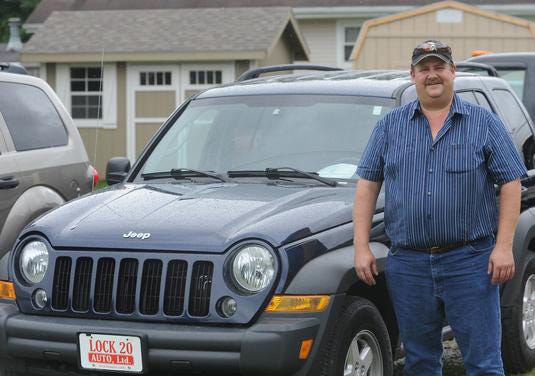 Lock 20 Auto owner Scott Welch in the car lot in Newcomerstown recently.