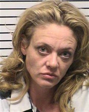 This photo provided by Iredell County, NC, sheriff's department, Lisa Robin Kelly is shown. Kelly is free on bond after being arrested for assault. Police in the Charlotte, N.C., suburb of Mooresville arrested the 42-year-old Kelly and 61-year-old husband Robert Joseph Gilliam after responding to a disturbance at their home Monday, Nov. 26, 2012. Both are free on bond. Gilliam is charged with misdemeanor assault on a female. Kelly is charged with misdemeanor assault. They were taken to the Iredell County Detention Center and released on $500 bond apiece. They have a court date of Jan. 25. It's not known if either has an attorney. Kelly portrayed Laurie Forman, sister of Topher Grace's lead character Eric, on the FOX series, which ended in 2006. She also appeared on the TV shows "Murphy Brown" and "Married . . . With Children." (AP Photo/Iredell County, NC, sheriff's department)