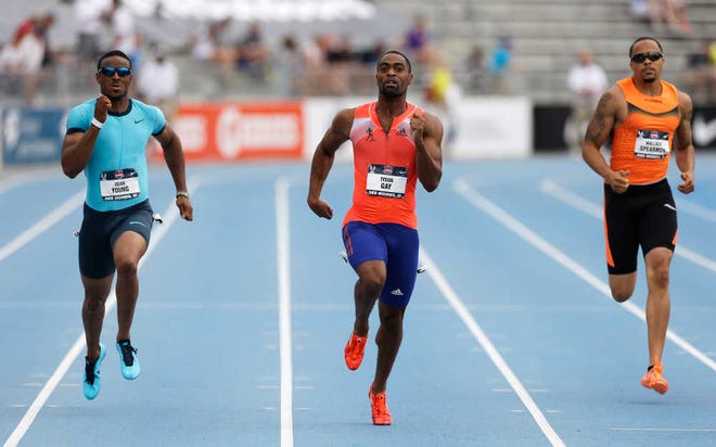 Tyson Gay (center) leads Isiah Young (left) and Wallace Spearmon during the finals of the 200-meter dash at the U.S. track championships Sunday.