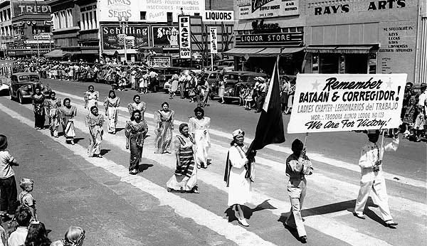 Filipinos march in a 4th of July parade in Stockton. Filipino bravery and sacrifice in battle against the Japanese in places such as Bata'an improved their status in the eyes of most Americans.