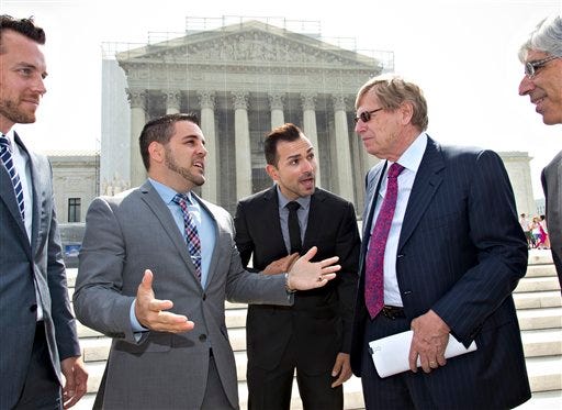 California's Proposition 8 same-sex marriage ban plaintiffs Jeff Zarrillo, left, and Paul Katami, center, talk to their attorney, Ted Olson, outside the Supreme Court on Thursday as they leave after the court heard arguments on their case. Sometime in July, the court will announce the outcomes in cases involving Proposition 8 and the federal Defense of Marriage Act, a law that defines marriage as the union of a man and a woman.