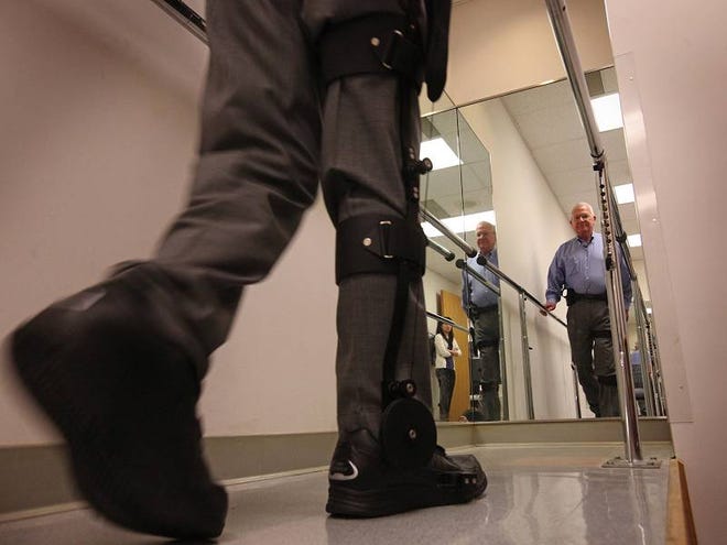 Carl Simmons, of Lynnwood, Wash., tries out the Kickstart walking device after being fitted with it at the Center for Prosthetics and Orthotics in Seattle. Simmons, who had a stroke, hopes to go dancing again with his wife, Peg.