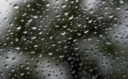 Raindrops cling to a car windshield in a parking lot on Hammer Lane and Don Avenue in Stockton.