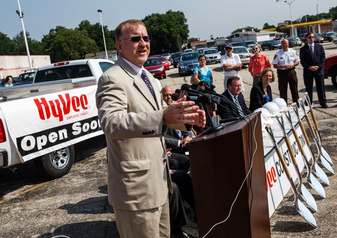 Ward 7 Ald. Joe McMenamin welcomes visitors to a groundbreaking for the new Hy-Vee grocery store in the old Kmart building on MacArthur Boulevard , Monday, June 24, 2013, in Springfield, Ill.