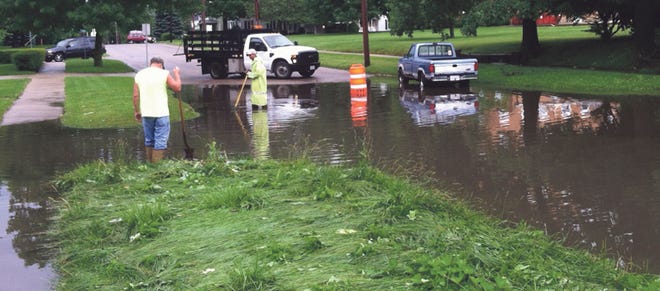 City crews were on West Prospect Street Monday morning, where a storm sewer backed up, flooding about a block of Prospect.