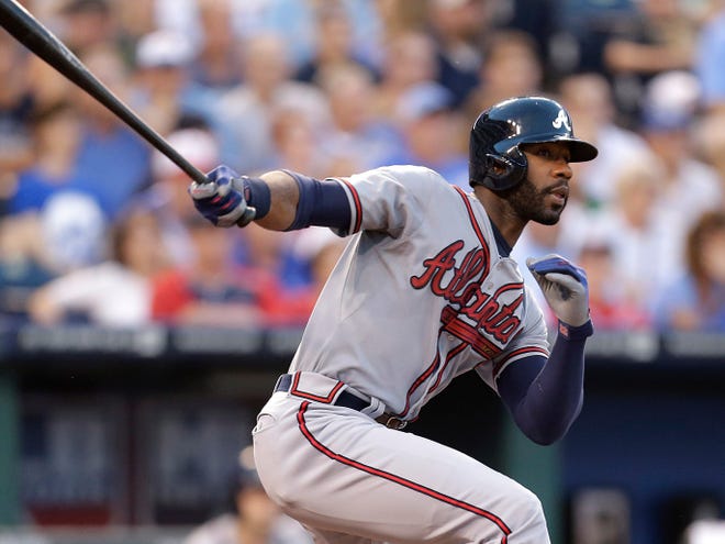 Atlanta's Jason Heyward hits a two-run double during the fifth inning against Kansas City on Tuesday night.