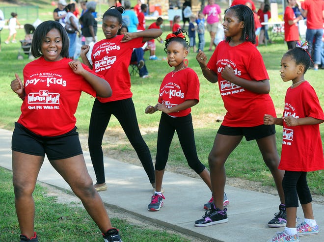 FILE - The dance team of "The Lady Lions" performs during the Boys and Girls Club's "Day for Kids" event at Moragne Park in Gadsden, Alabama. September 15, 2012.