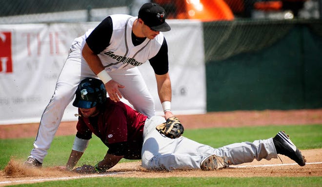 Savannah's Stefan Sabol slides safely into third as Augusta's Shayne Houck can't apply the tag in time.