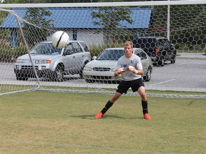 Tyler Gillespie, starting goalkeeper for the Players Development Academy Florida U16 soccer squad, warms up before the team's game on Saturday.