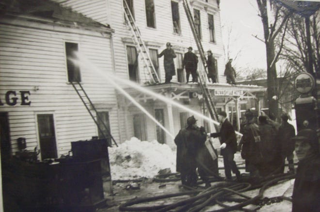 The Munnsville Volunteer Fire Department battles a blaze at the Munnsville Hotel in March 1947 in this vintage file photo. The department celebrates their 100th anniversary this year with three days of a big birthday party, July 12-14, behind the South Main Street fire station.