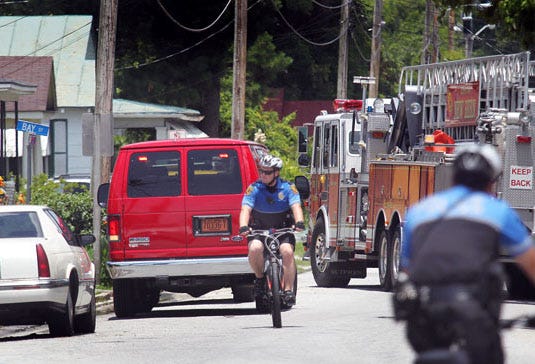 New Bern police officers ride their bikes around the neighborhood of Duffyfield making sure the residents stayed in their homes while an accidental gas line was being repaired.