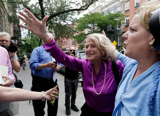 Edith Windsor, left, the plaintiff in the historic gay marriage case before the U.S. Supreme Court, accompanied by her attorney Robert Kaplan, arrives at the LGBT Center for a news conference, in New York, Wednesday. In a major victory for gay rights, the Supreme Court on Wednesday struck down a provision of a federal law denying federal benefits to married gay couples and cleared the way for the resumption of same-sex marriage in California.
