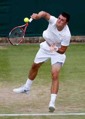 Bernard Tomic's father, John, has been banned by the ATP and isn't allowed in Wimbledon.