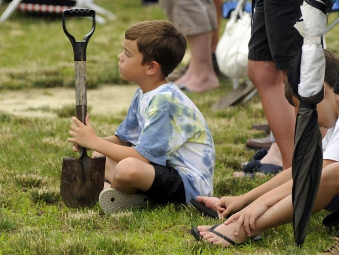 Zach Lawrence,8, of Hainesport with shovel in hand at Wednesday's ground-breaking at Fellowship Alliance Chapel in Medford . Parishioners of Fellowship Alliance Chapel were encouraged to bring a shovel to join in on the ground-breaking for their new chapel.