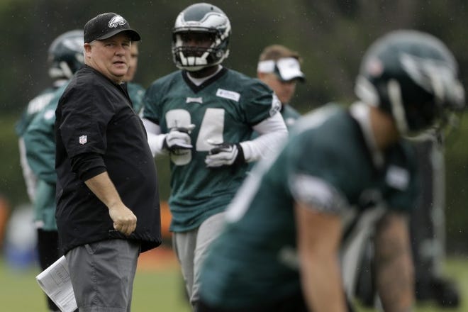 Eagles head coach Chip Kelly supervises an offseason workout.