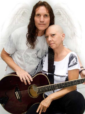 Brad Sayre, with longtime friend Annette Swaim, will headline a free concert for the Port Orange resident who has stage-four lung cancer. Swaim’s sister, Barbara Simmons, is a professional photographer who has done Sayre’s publicity photos.