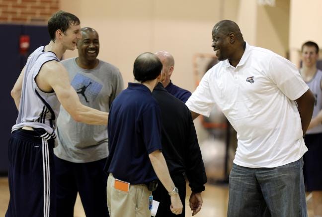 The Bobcats took former Indiana player Cody Zeller, seen shaking the hand of assistant coach Patrick Ewing, after scouting him during a June 19 pre-draft workout in Charlotte.
