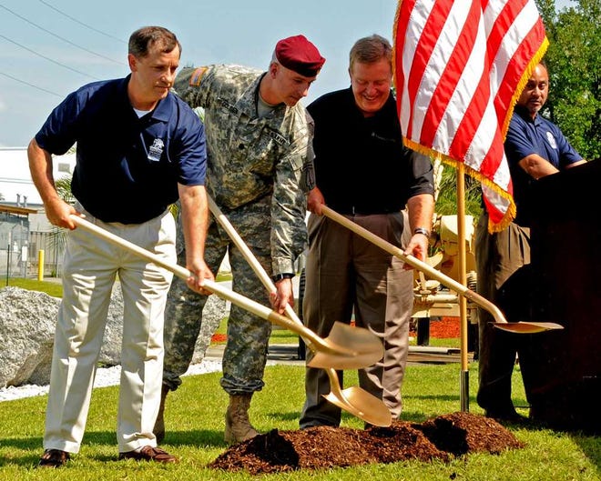Corey Dickstein/Savannah Morning NewsOfficials break ground Thursday afternoon on a memorial dedicated to fallen soldiers from the 3rd Battalion, 160th Special Operations Aviation Regiment. Pictured left to right outside the battalion's headquarters on Hunter Army Airfield are Guy Soper, president of the Night Stalker Hero Memorial of Savannah Foundation; Lt. Col. Bill Golden, the battalion's commander; and Dan Gay, of Thomas & Hutton engineering who designed the monument.