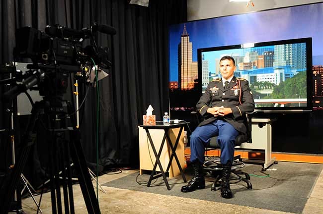 Spc. Julian Chavez, a forward observer assigned to 2nd Battalion, 319th Airborne Field Artillery Regiment, 2nd Brigade Combat Team, 82nd Airborne Division, conducts a remote, live interview on the Fox and Friends program from Raleigh, N.C., June 1. Chavez participated in the interview to talk about his personal experiences as a part of the Army’s Starting Strong reality television-based recruiting program.