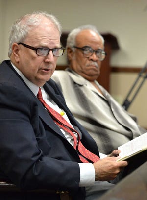 Former Gov. Roy Barnes (left) speaks as his client, Rep. Tyrone Brooks, looks on in Atlanta. Brooks won't be suspended while he faces fraud charges.