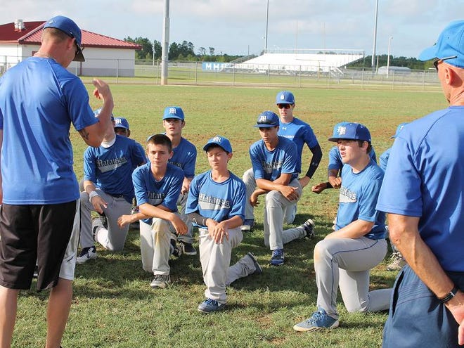 Matanzas baseball coach Rob Roe, left, talks with his players after a game this week. The developmental sessions are meant for young players just entering high school or who are a year or two away.