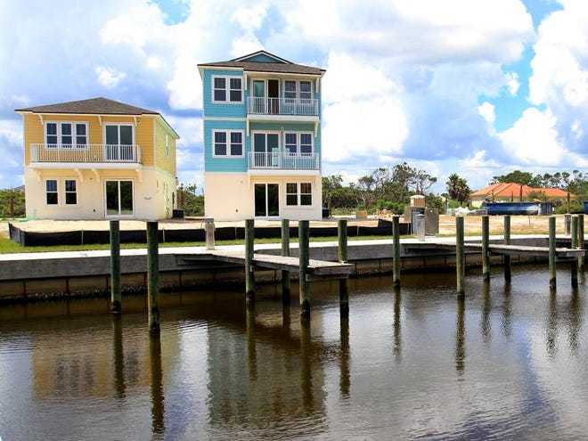 A few of the boat slips are shown at Sunset Inlet development in Beverly Beach. The new homes beckon anyone to stop in and take a peek at available models.