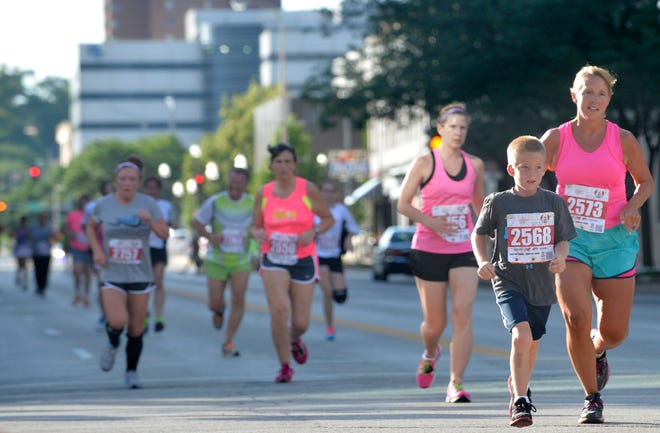 Runners compete in the Main Street Mile.