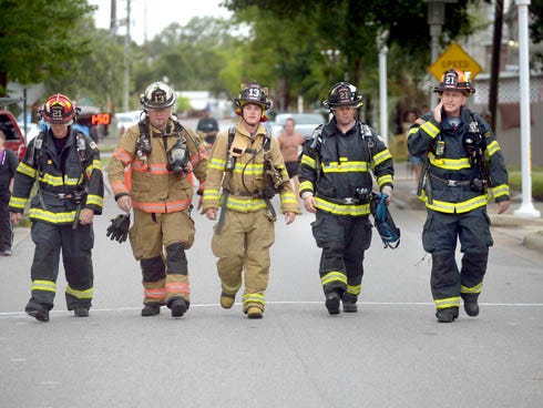 Firefighters from both Niceville and East Niceville fire departments walked the Indian Sunrise 5K on Saturday in full bunker gear and air tanks to honor firefighters who have died in service and more recently four firefighters in Houston, Texas who lost their lives while fighting a fire when a building collapsed on them.