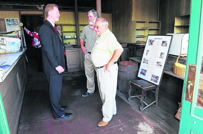B.A. Feeney, left, assistant vice president of Catskill Hudson Bank; Ken Salzmann, center, executive director of the Jewish Federation of Ulster County; and Lew Kirschner, honorary chairman for the Jewish Federation of Ulster County, talk inside the 19th century Reher Bakery building after a groundbreaking ceremony.