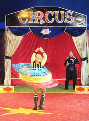 Tatiana Ariestov performs with hula hoops during the circus at the Brockton Fair on Saturday, June 29, 2013.
