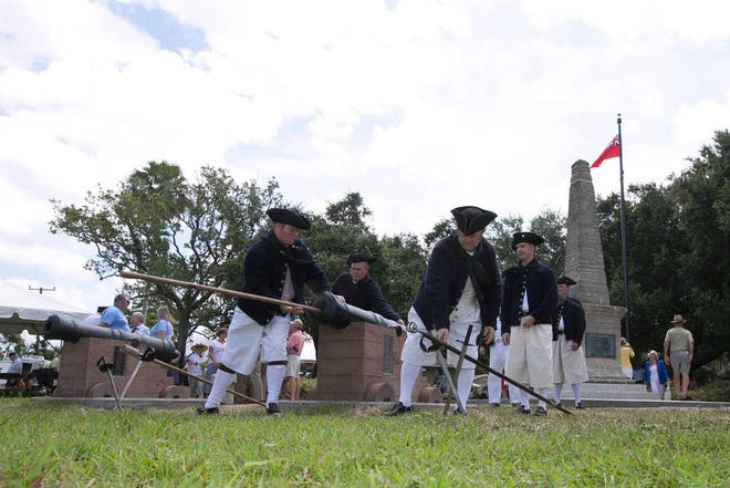 Photos by Perry Knotts St. Augustine Record Re-enactors portraying British soldiers perform a cannon firing demonstration during the cannon battery dedication at Oglethorpe Park on Davis Shores on Sunday.