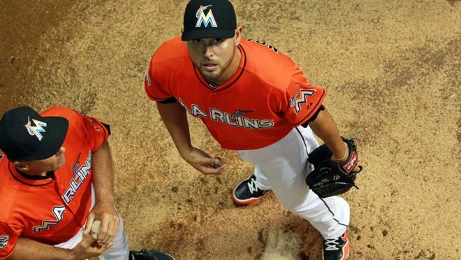 Marlins pitcher Ricky Nolasco gets ready to warm up in the bullpen in left field at Marlins Park last season. (Allen Eyestone/The Palm Beach Post)