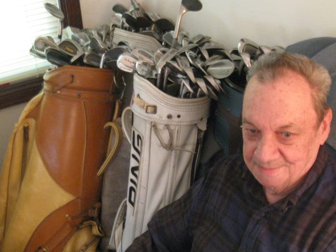 Cliff Henry and his golf clubs.