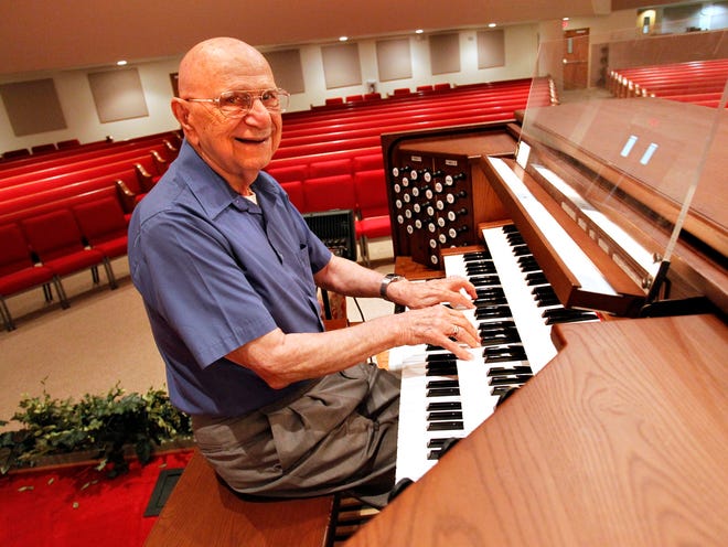 Gilbert Cicio, the retiring organist at Northwest Baptist Church, sits at the organ he helped to pic out for the church before a retirement ice cream social for Gilbert, at the churches Fellowship Hall, in Gainesville, Sunday June 30, 2013. Cicio has played organ at Northwest Baptist for the past 11 years and has played the organ for 67 years around the country from New York to Ft. Lauderdale to Gainesville.